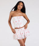 Create bold, fashion-forward looks for spring or summer with the Call Me Cutie Floral Eyelet Mini Skirt in white, a must-have piece from Windsor’s collection of stylish bottoms for women.