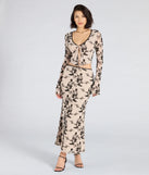 Create bold, fashion-forward looks for spring or summer with the Flirt Alert Flocked Floral Mesh Maxi Skirt in ivory, a must-have piece from Windsor’s collection of stylish bottoms for women.