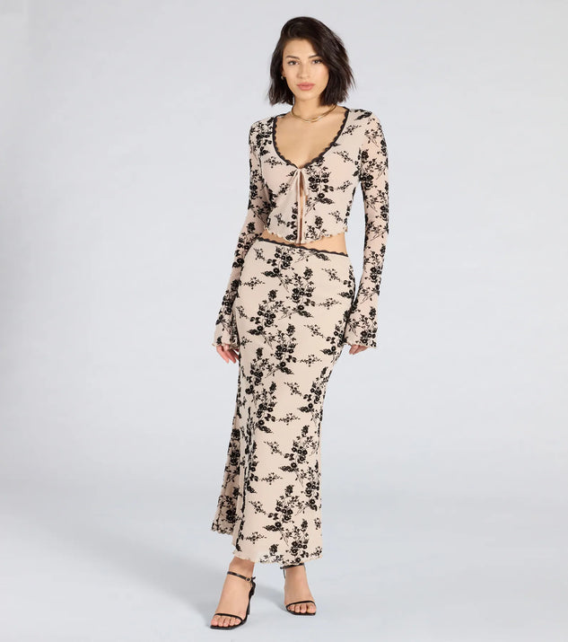 Create bold, fashion-forward looks for spring or summer with the Flirt Alert Flocked Floral Mesh Maxi Skirt in ivory, a must-have piece from Windsor’s collection of stylish bottoms for women.