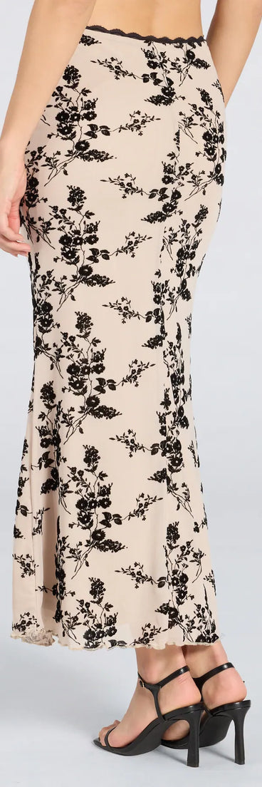 Create bold, fashion-forward looks for summer with the Flirt Alert Flocked Floral Mesh Maxi Skirt in ivory, a must-have piece from Windsor’s collection of stylish bottoms for women.