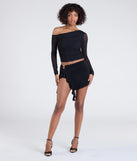 Create bold, fashion-forward looks for summer with the Feeling Myself Slit Ruffle Mini Skirt in black, a must-have piece from Windsor’s collection of stylish bottoms for women.