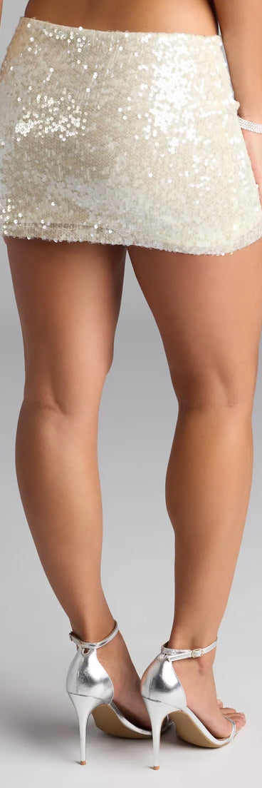 The High Shine Sequin Mini Skirt in yellow features a short, flattering cut designed to elevate your look with just the right amount of edge.