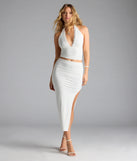 Choosing the ivory skirt says you’re ready to show off in the Flirty Ways Ruched High Slit Midi Skirt, a warm-weather staple that elevates your outfit and seasonal style.