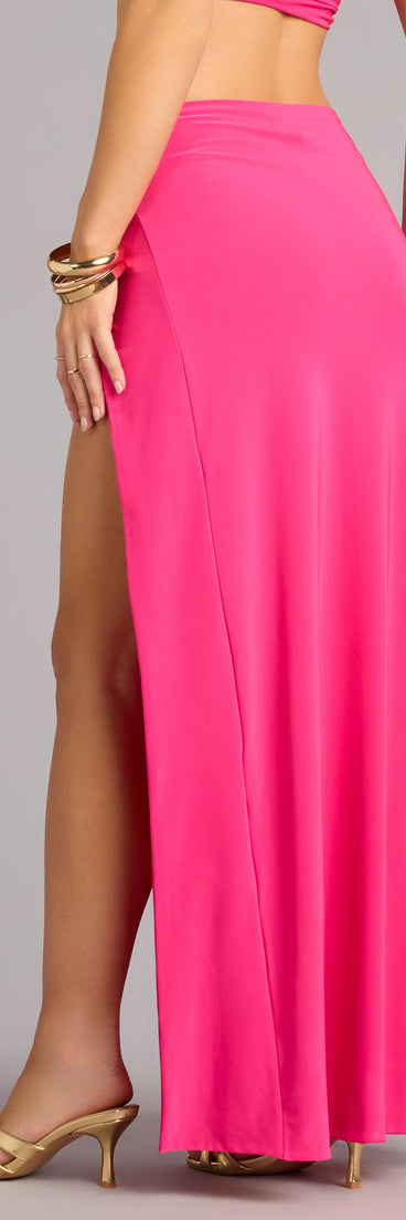 Get into matching sets with the Eyes On You High Slit Maxi Skirt in neon-pink, an easy outfit choice that balances trend and versatility.