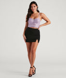 The Get Down With Basic Slit Mini Skirt is a trendy women's bottom in black, designed with modern details and alluring textures to complete chic outfits for 2025.