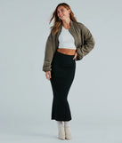 The Another Slay Sweater Knit Maxi Skirt in black is a women's workwear piece offering a trendy style and unique accents, perfect for effortlessly creating an outfit-of-the-day look that transitions your office look to going-out ready.