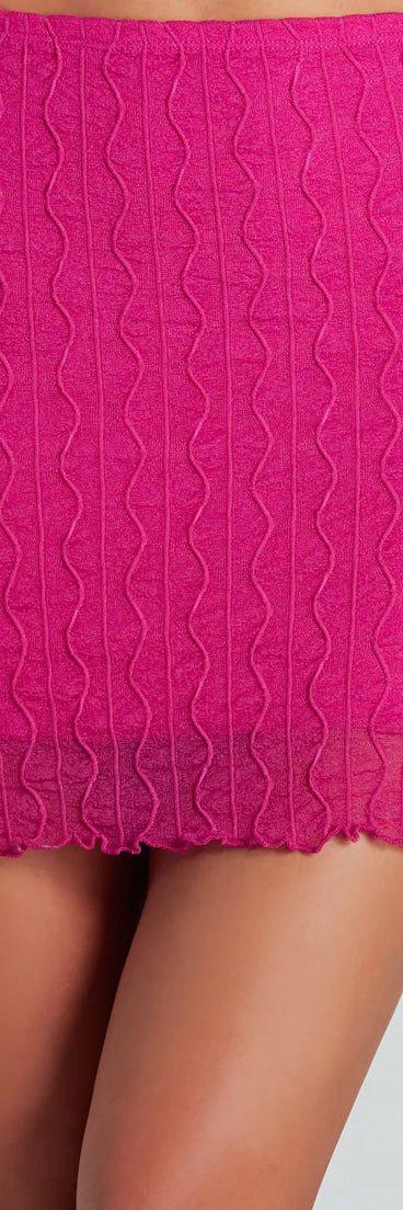 The Feeling Daring Texture Knit Mini Skirt is a trendy women's bottom in fuchsia, designed with modern details and alluring textures to complete chic outfits for 2025.