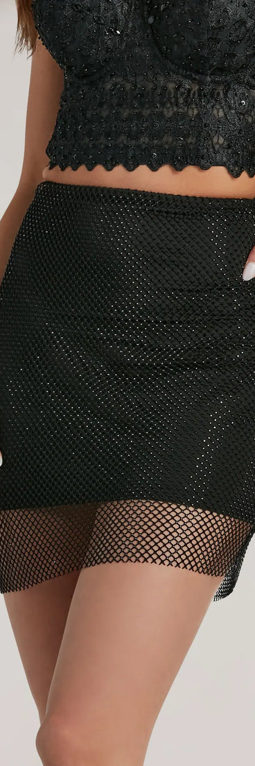 The Party Mood Rhinestone Sheer Fishnet Mini Skirt is a trendy women's bottom in black, designed with modern details and alluring textures to complete chic outfits for 2025.