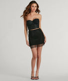 The Party Mood Rhinestone Sheer Fishnet Mini Skirt in black features a short, flattering cut designed to elevate your look with just the right amount of edge.