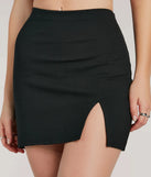 The Fabulous Fit Side Slit Knit Mini Skirt in black features a short, flattering cut designed to elevate your look with just the right amount of edge.