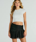 The Sweet Talking Lace Ruffle Mini Skirt is a trendy women's bottom in black, designed with modern details and alluring textures to complete chic outfits for 2025.