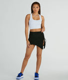 The Hold It Down Ruched Asymmetrical Mini Skirt in black brings edge and energy to your vibe, ready to elevate any festival look or concert outfit.
