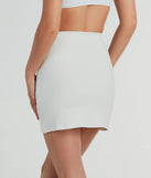 The Fabulous Fit Side Slit Knit Mini Skirt in ivory features a short, flattering cut designed to elevate your look with just the right amount of edge.