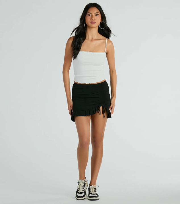 The Made Ya Wink Mid-Rise Ruffle Mini Skirt is a trendy women's bottom in black, designed with modern details and alluring textures to complete chic outfits for 2025.