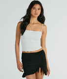 The Made Ya Wink Mid-Rise Ruffle Mini Skirt is a trendy women's bottom in black, designed with modern details and alluring textures to complete chic outfits for 2025.