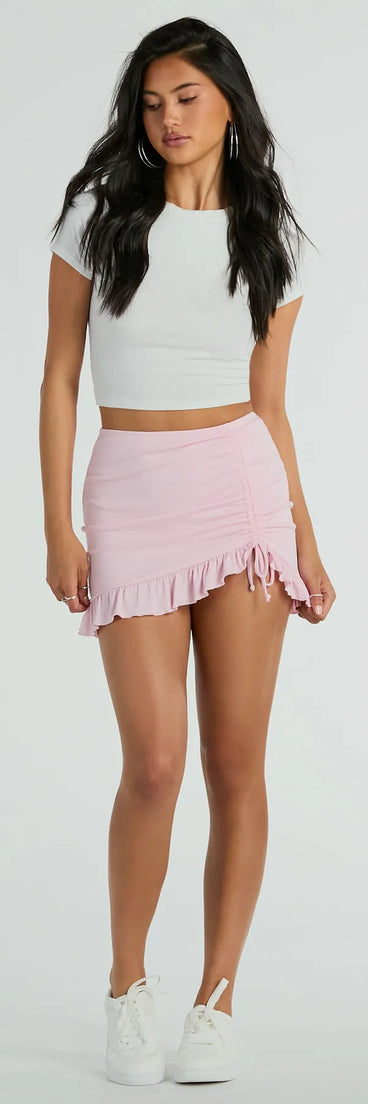 The Made Ya Wink Mid-Rise Ruffle Mini Skirt is a trendy women's bottom in pink, designed with modern details and alluring textures to complete chic outfits for 2025.