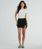 The Loveliest Look Bow Ponte Slit Mini Skirt is a trendy women's bottom in black, designed with modern details and alluring textures to complete chic outfits for 2025.