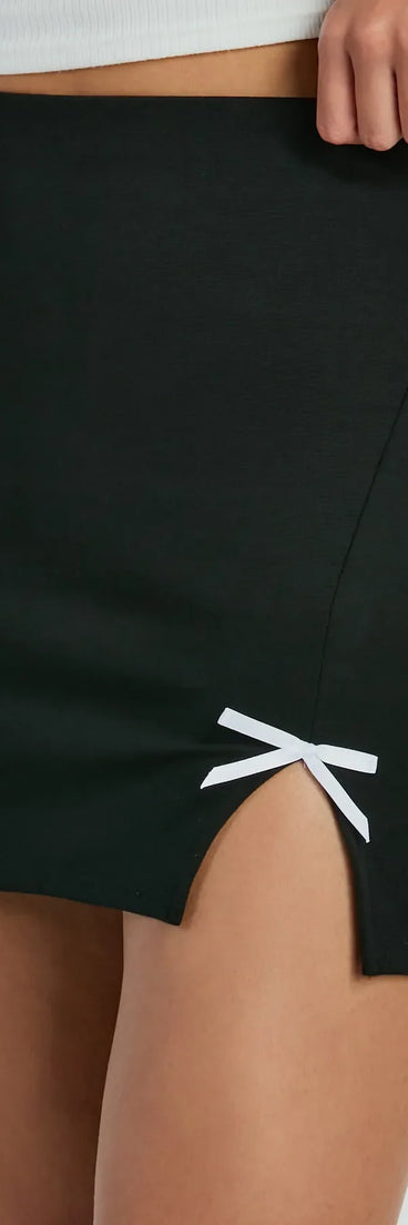The Loveliest Look Bow Ponte Slit Mini Skirt is a trendy women's bottom in black, designed with modern details and alluring textures to complete chic outfits for 2025.