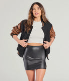 The Sleek Status Faux Leather Mini Skirt is a trendy women's bottom in black, designed with modern details and alluring textures to complete chic outfits for 2025.