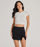 The Left And Right High Rise Bow Slit Mini Skirt is a trendy women's bottom in black, designed with modern details and alluring textures to complete chic outfits for 2025.