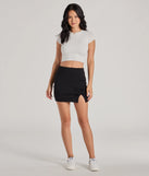 The Left And Right High Rise Bow Slit Mini Skirt is a trendy women's bottom in black, designed with modern details and alluring textures to complete chic outfits for 2025.
