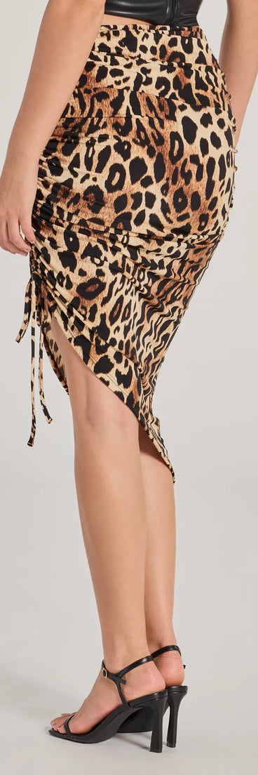 The Take The Lead Leopard Print Ruched Midi Skirt is a trendy women's bottom in leopard print, designed with modern details and alluring textures to complete chic outfits for 2025.