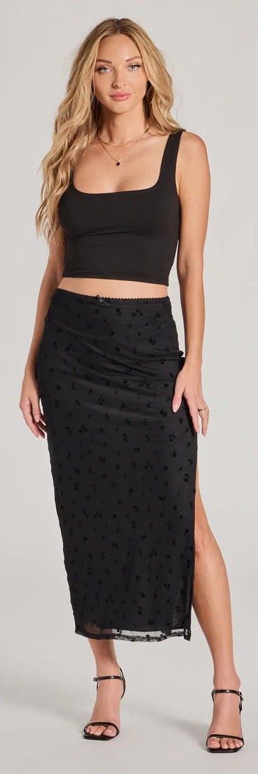 The Evening Perfection High-Rise Flocked Floral Maxi Skirt in black is a women's workwear essential with an elevated fabric and chic silhouette, ideal for layering and versatile enough to take your look from office chic to going-out ready!