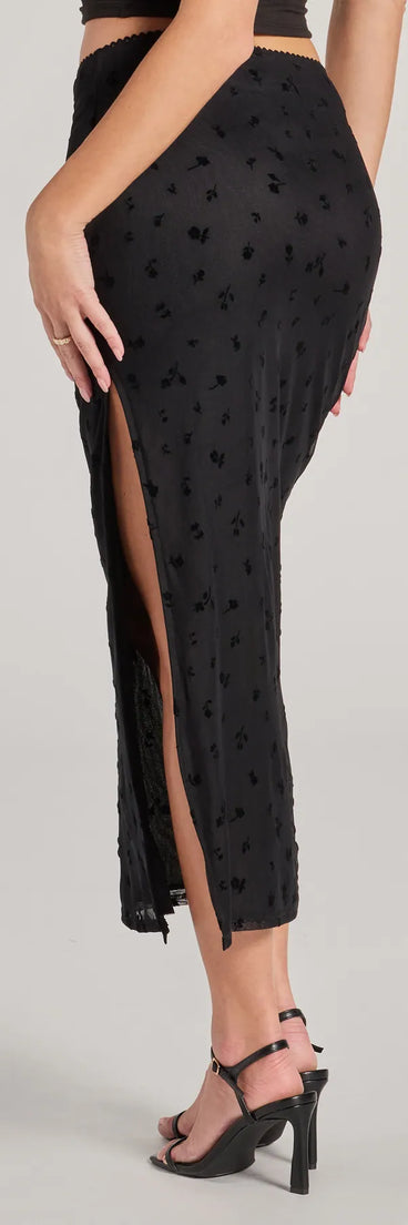 The Evening Perfection High-Rise Flocked Floral Maxi Skirt is a trendy women's bottom in black, designed with modern details and alluring textures to complete chic outfits for 2025.