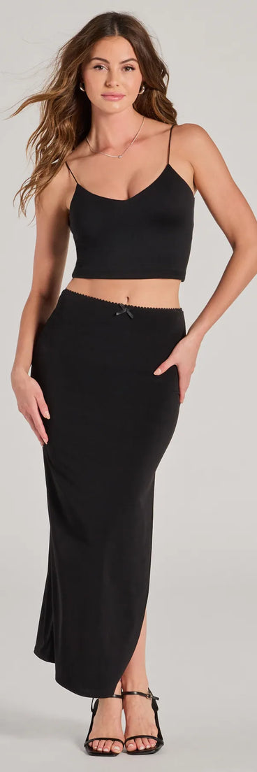 The Effortless Sleekness High Rise Slit Maxi Skirt is a trendy women's bottom in black, designed with modern details and alluring textures to complete chic outfits for 2025.