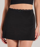 The Total Sweetness High-Rise Lace Trim Skirt in black features a short, flattering cut designed to elevate your look with just the right amount of edge.