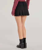 The Playful Twist Ponte Knit Drop Waist Pleated Mini Skirt is a trendy women's bottom in black, designed with modern details and alluring textures to complete chic outfits for 2025.
