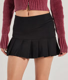 Create bold, fashion-forward looks for spring or summer with the Playful Twist Ponte Knit Drop Waist Pleated Mini Skirt in black, a must-have piece from Windsor’s collection of stylish bottoms for women.