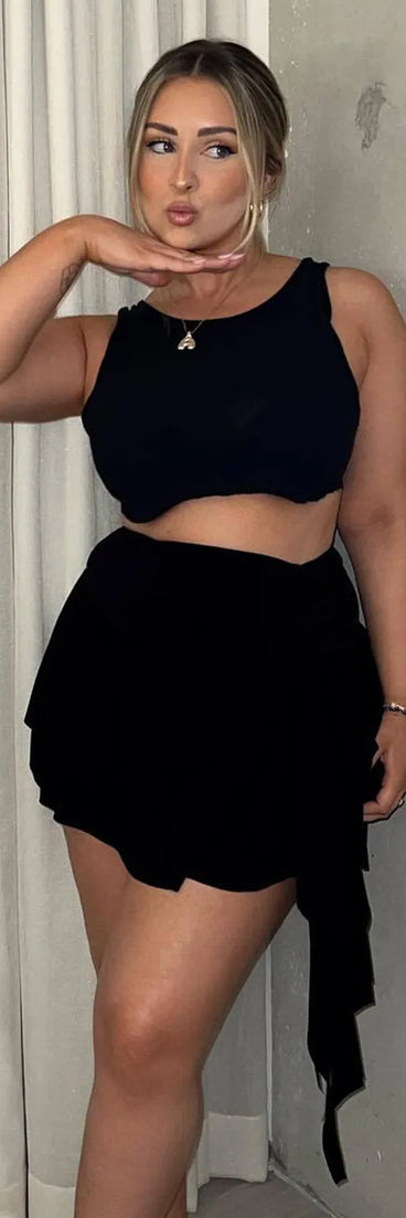 Pair the Major Flirt Drop Waist Smooth Knit Ruffled Mini Skirt with your favorite crop or bodysuit for effortless warm-weather looks with on-trend black skirts that speak your style.