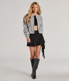 The Major Flirt Drop Waist Smooth Knit Ruffled Mini Skirt in black features a short, flattering cut designed to elevate your look with just the right amount of edge.