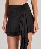Create bold, fashion-forward looks for summer with the Major Flirt Drop Waist Smooth Knit Ruffled Mini Skirt in black, a must-have piece from Windsor’s collection of stylish bottoms for women.