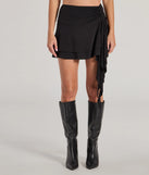 The Major Flirt Drop Waist Smooth Knit Ruffled Mini Skirt is a trendy women's bottom in black, designed with modern details and alluring textures to complete chic outfits for 2025.