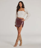 The Bold Allure Faux Leather Mini Skirt in wine features a short, flattering cut designed to elevate your look with just the right amount of edge.