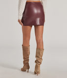 The Bold Allure Faux Leather Mini Skirt is a trendy women's bottom in wine, designed with modern details and alluring textures to complete chic outfits for 2025.