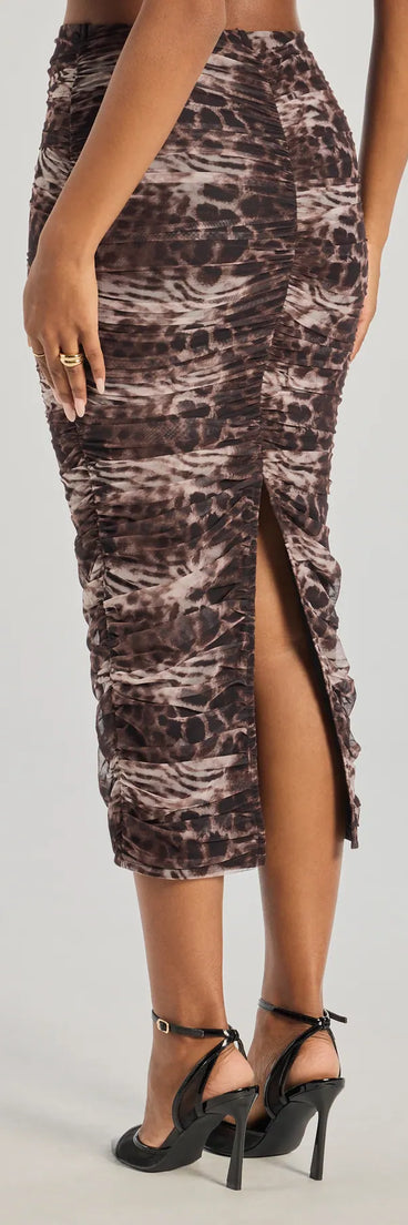 The Unmatched Boldness Leopard Print Midi Skirt is a trendy women's bottom in multi-color, designed with modern details and alluring textures to complete chic outfits for 2025.