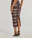 The Unmatched Boldness Leopard Print Midi Skirt is a trendy women's bottom in multi-color, designed with modern details and alluring textures to complete chic outfits for 2025.