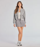 The Preppy Pleated Goals Mini Skirt is a trendy women's bottom in gray, designed with modern details and alluring textures to complete chic outfits for 2025.