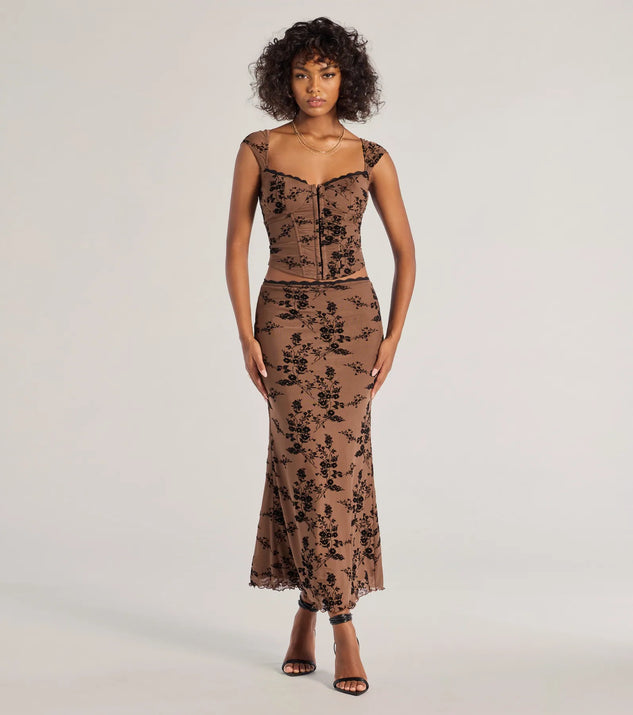 The Romantic Aura Flocked Floral Mesh Maxi Skirt is a trendy women's bottom in brown, designed with modern details and alluring textures to complete chic outfits for 2025.