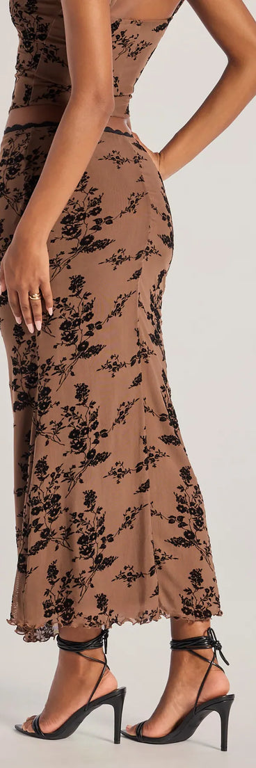 The Romantic Aura Flocked Floral Mesh Maxi Skirt is a trendy women's bottom in brown, designed with modern details and alluring textures to complete chic outfits for 2025.