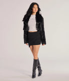 The Twist And Twirl Wrap Mini Skirt is a trendy women's bottom in black, designed with modern details and alluring textures to complete chic outfits for 2025.