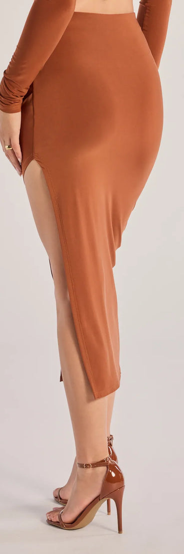 The Bold Staple Ruched Asymmetrical Midi Skirt is a trendy women's bottom in camel brown, designed with modern details and alluring textures to complete chic outfits for 2025.