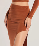 Create bold, fashion-forward looks for spring or summer with the Bold Staple Ruched Asymmetrical Midi Skirt in camel brown, a must-have piece from Windsor’s collection of stylish bottoms for women.