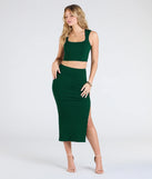 Create bold, fashion-forward looks for spring or summer with the Elevated Era Ribbed Knit High Slit Midi Skirt in hunter green, a must-have piece from Windsor’s collection of stylish bottoms for women.