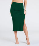 Create bold, fashion-forward looks for spring or summer with the Elevated Era Ribbed Knit High Slit Midi Skirt in hunter green, a must-have piece from Windsor’s collection of stylish bottoms for women.