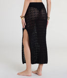 Create bold, fashion-forward looks for summer with the PENDING BUYER CONFIRMATION - Crochet Knit High Slit Maxi Skirt in black, a must-have piece from Windsor’s collection of stylish bottoms for women.