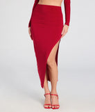 The Bold Staple Ruched Asymmetrical Midi Skirt is a trendy women's bottom in red, designed with modern details and alluring textures to complete chic outfits for 2025.